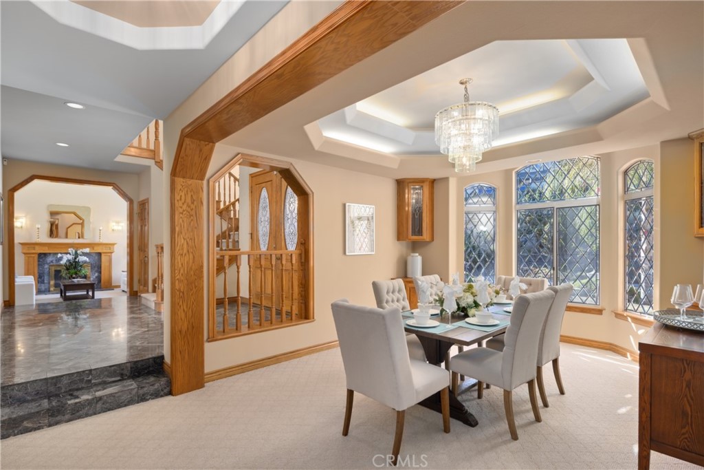 102 Mill Run Monrovia, CA 91016 - Photo 26 of 75 a dining room with furniture a chandelier and large window