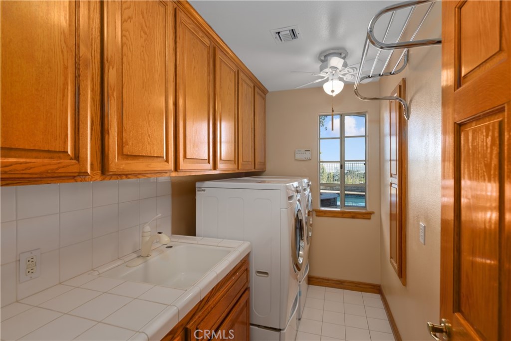 102 Mill Run Monrovia, CA 91016 - Photo 33 of 75 a bathroom with a sink a mirror and a shower