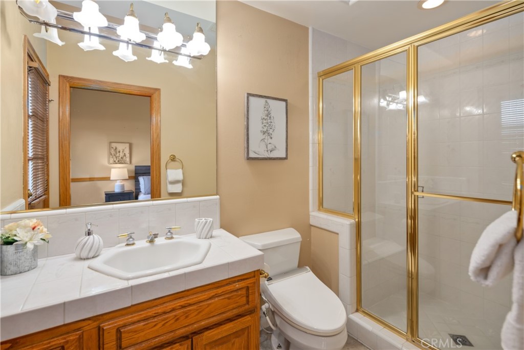 102 Mill Run Monrovia, CA 91016 - Photo 36 of 75 a bathroom with a sink vanity mirror and toilet