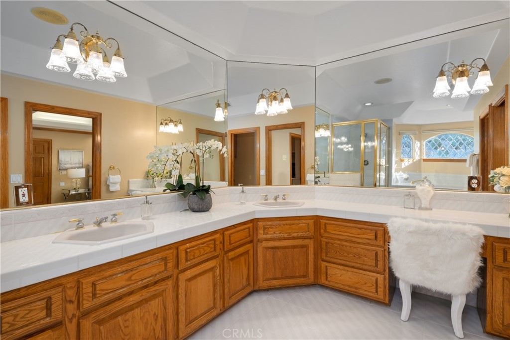 102 Mill Run Monrovia, CA 91016 - Photo 44 of 75 a spacious bathroom with a sink a large mirror and a shower