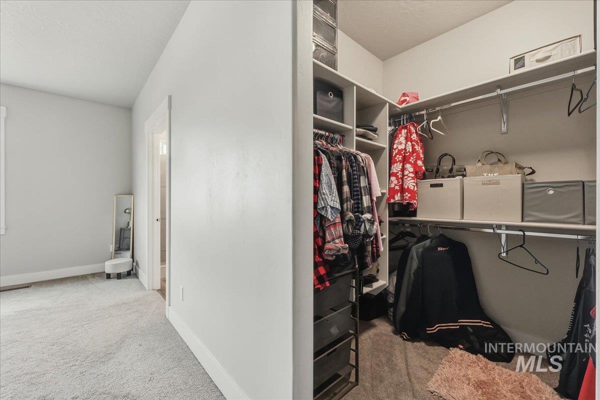 305 Tiffany Rose Way Wilder, ID 83676 - Photo 20 of 31 Walk in closet with light carpet