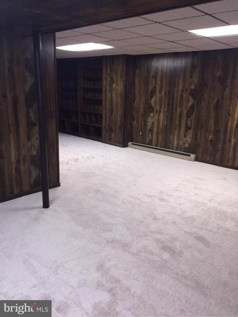 3213 Llewellyn Field Road Olney, MD 20832 - Photo 11 of 30 a view of an empty room with a wooden partition