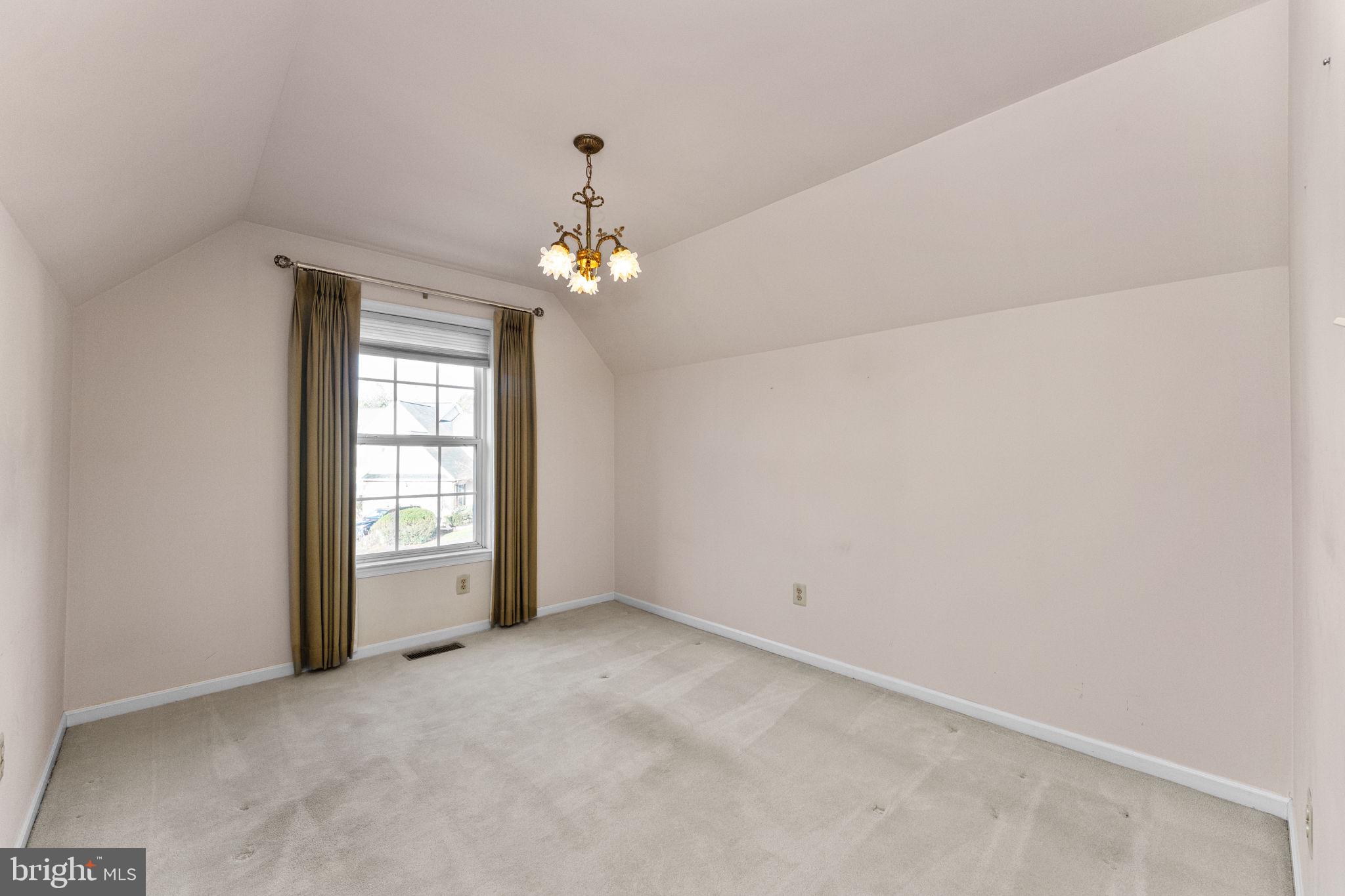 376 Hobson Place Blue Bell, PA 19422 - Photo 19 of 29 an empty room with chandelier fan and windows