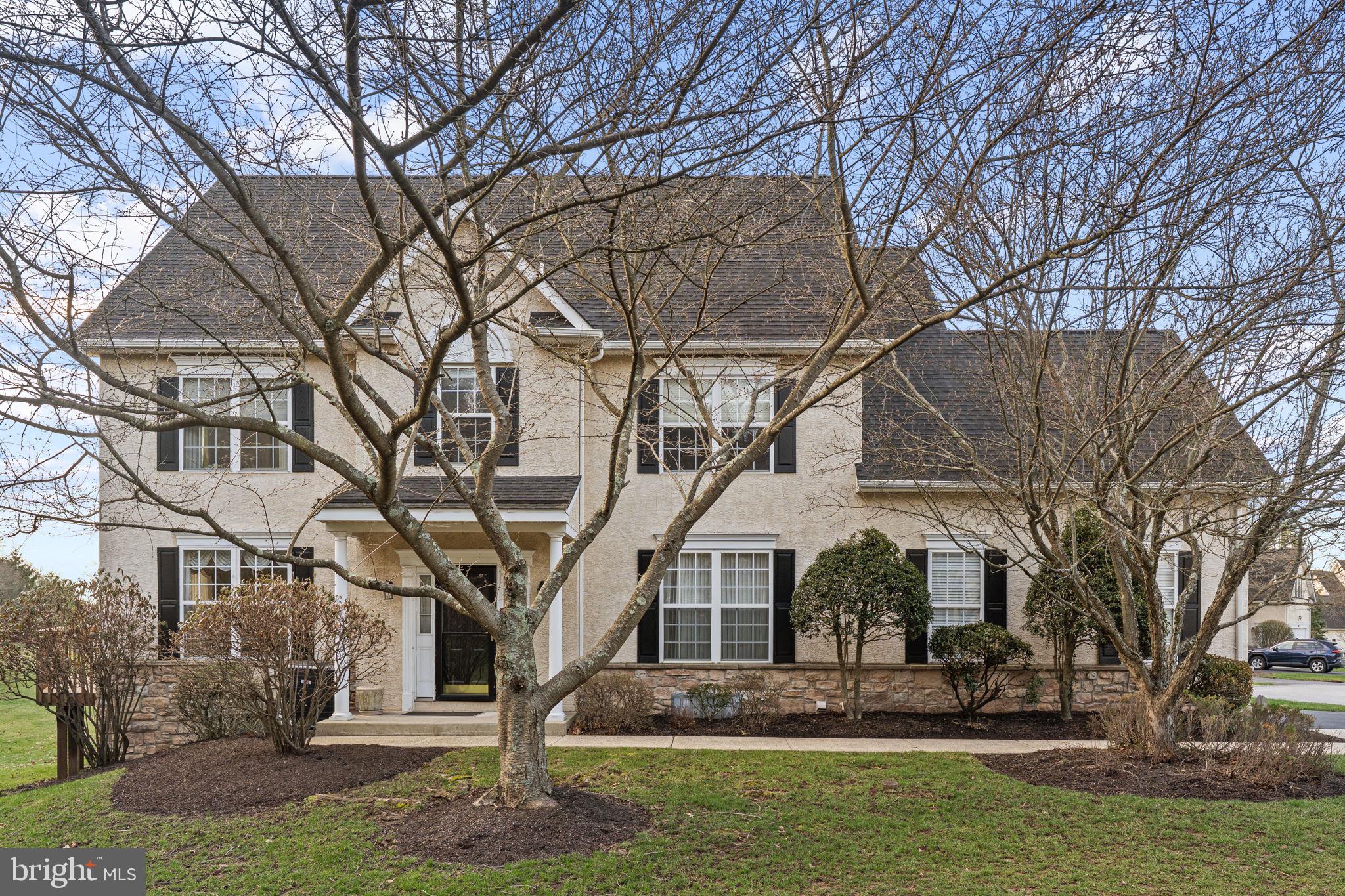 376 Hobson Place Blue Bell, PA 19422 - Photo 2 of 29 a front view of a house with a yard