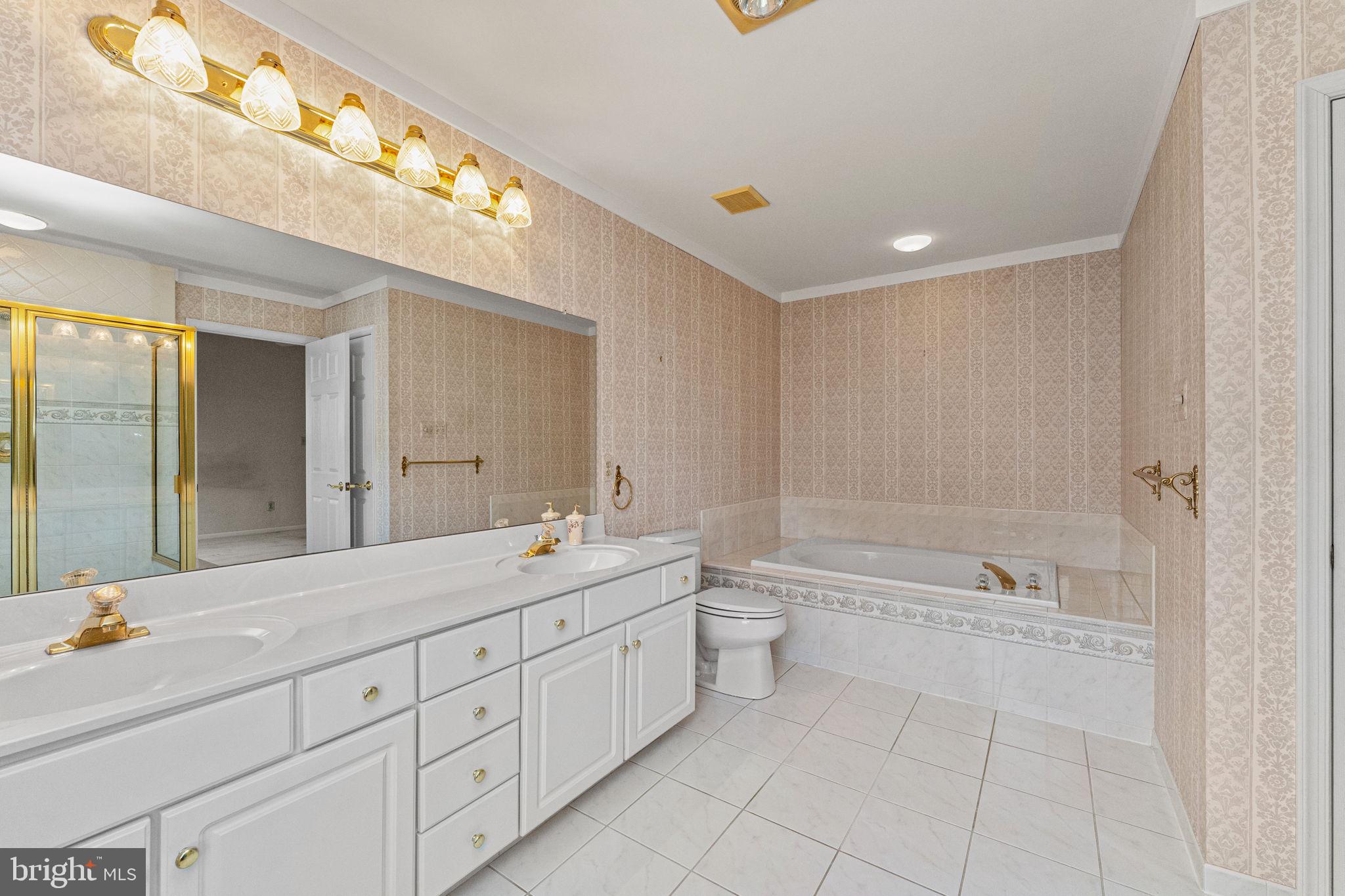376 Hobson Place Blue Bell, PA 19422 - Photo 21 of 29 a spacious bathroom with a double vanity sink toilet mirror and bathtub
