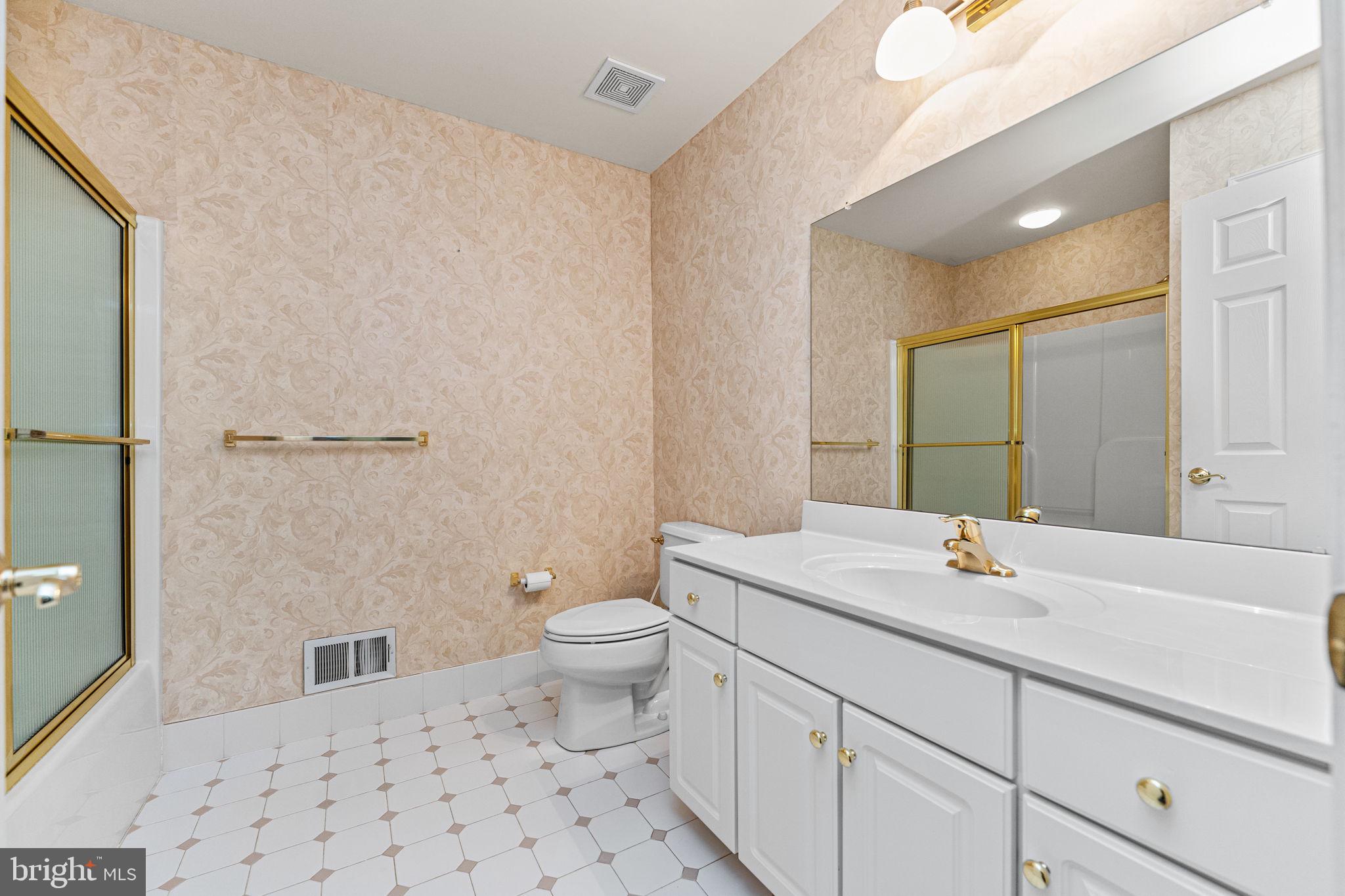 376 Hobson Place Blue Bell, PA 19422 - Photo 26 of 29 a bathroom with a sink a toilet a mirror and shower
