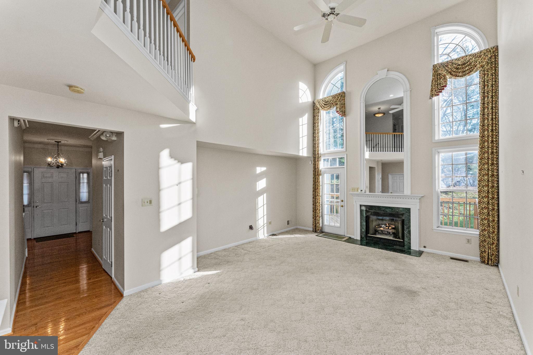 376 Hobson Place Blue Bell, PA 19422 - Photo 5 of 29 a view of an empty room with a fireplace and a window