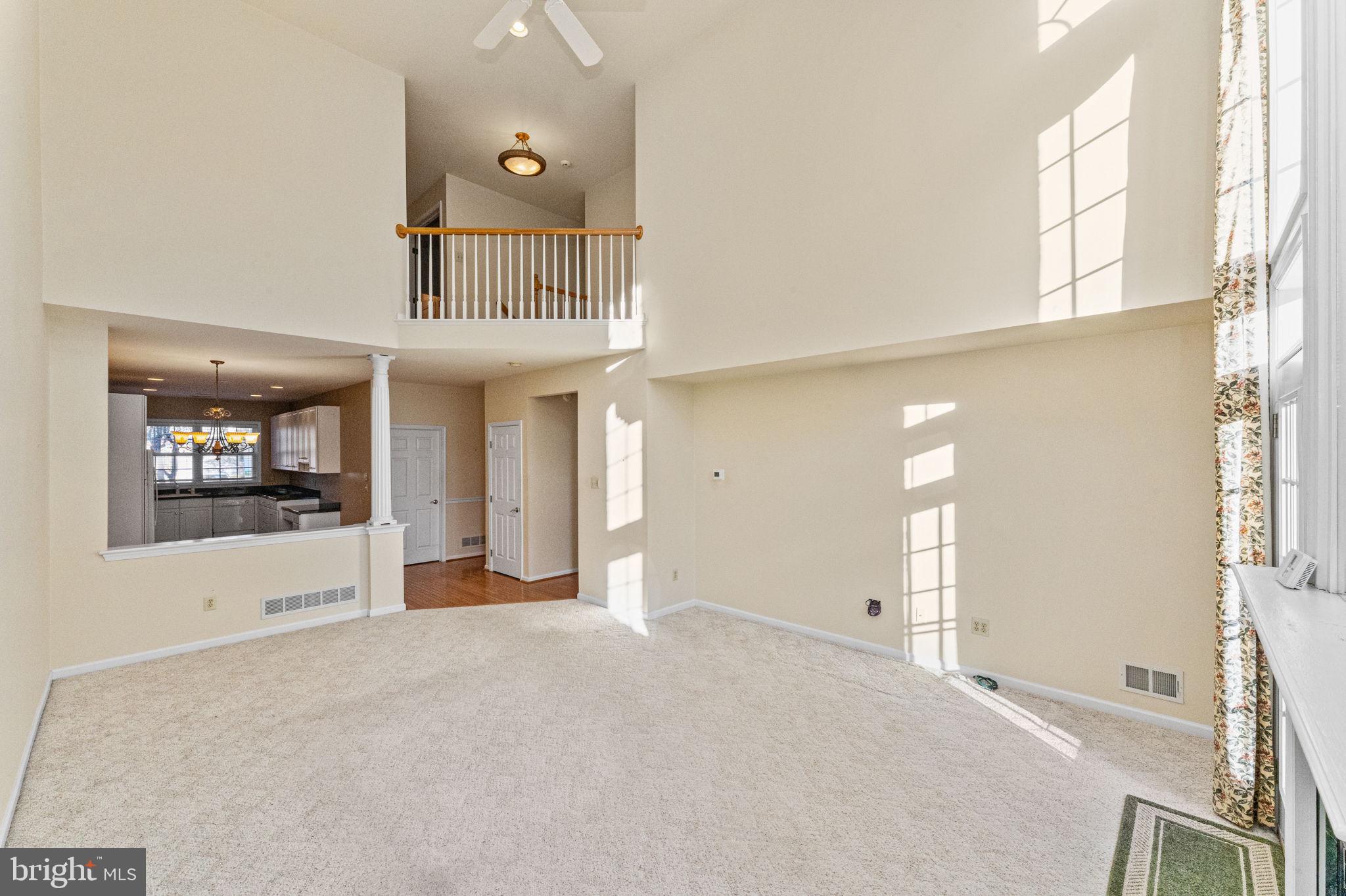 376 Hobson Place Blue Bell, PA 19422 - Photo 6 of 29 a view of a big room with windows and chandelier