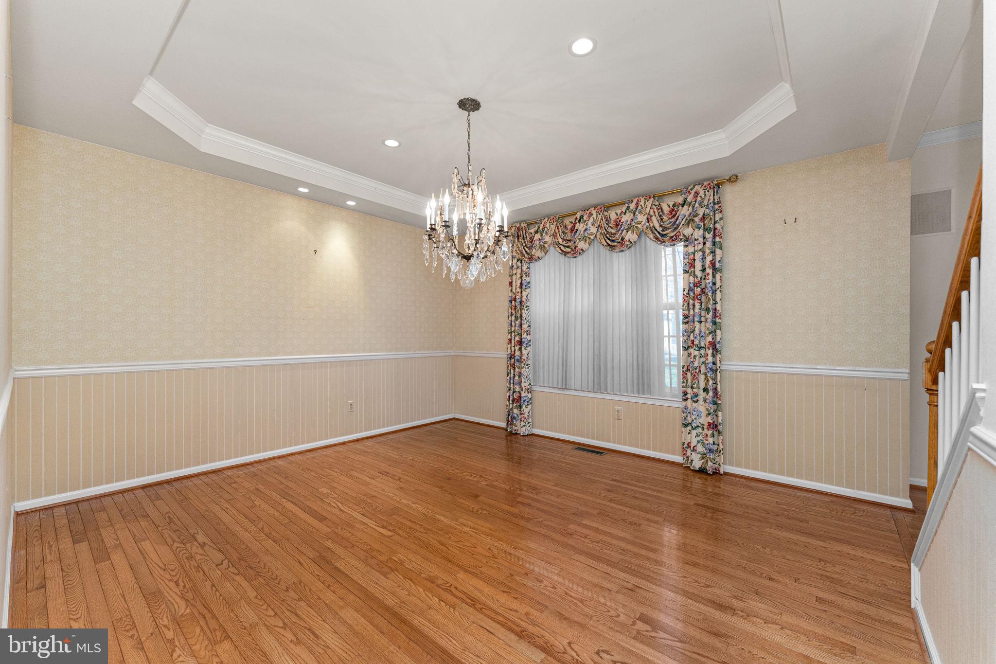 376 Hobson Place Blue Bell, PA 19422 - Photo 7 of 29 an empty room with wooden floor chandelier fan and windows