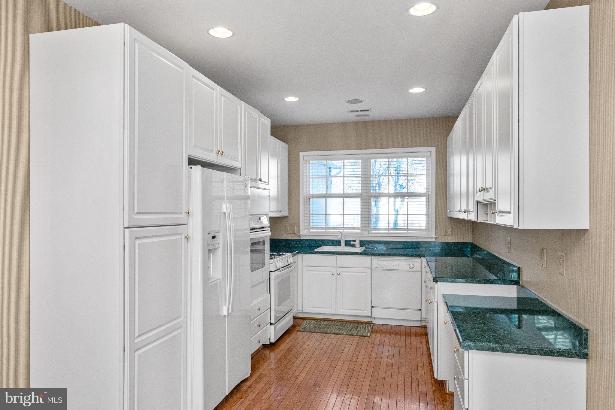 376 Hobson Place Blue Bell, PA 19422 - Photo 9 of 29 a kitchen with granite countertop a refrigerator sink and cabinets