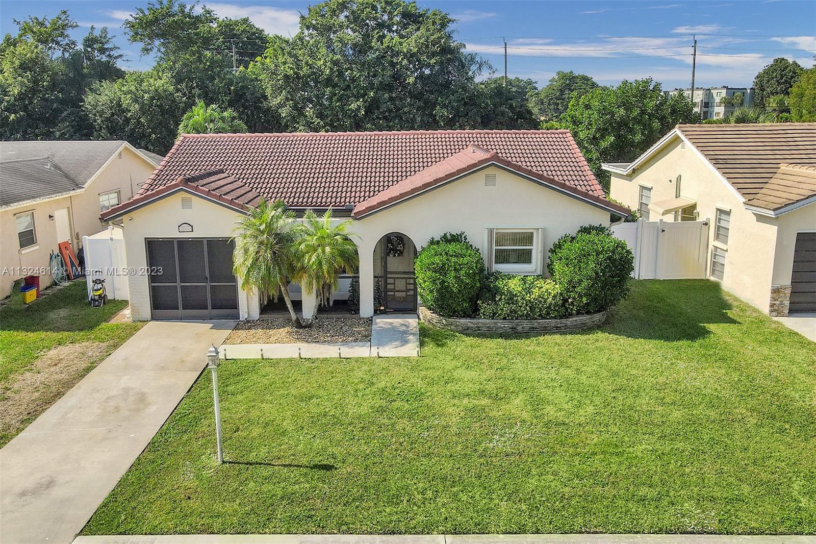 22777 Southwest 56th Avenue Boca Raton, FL 33433 - Photo 1 of 34 a view of a house with backyard and garden