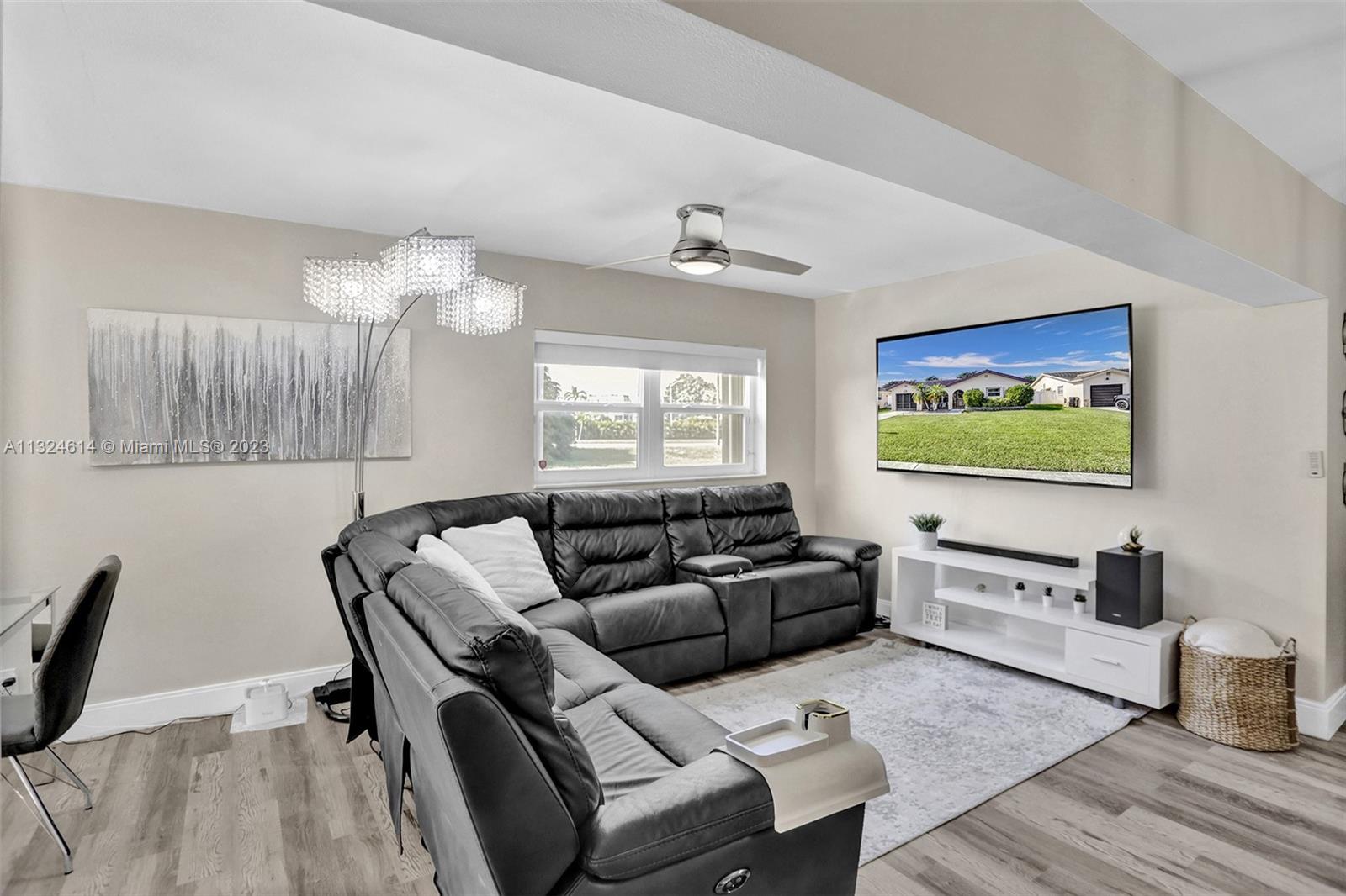 22777 Southwest 56th Avenue Boca Raton, FL 33433 - Photo 11 of 34 a living room with furniture and wooden floor