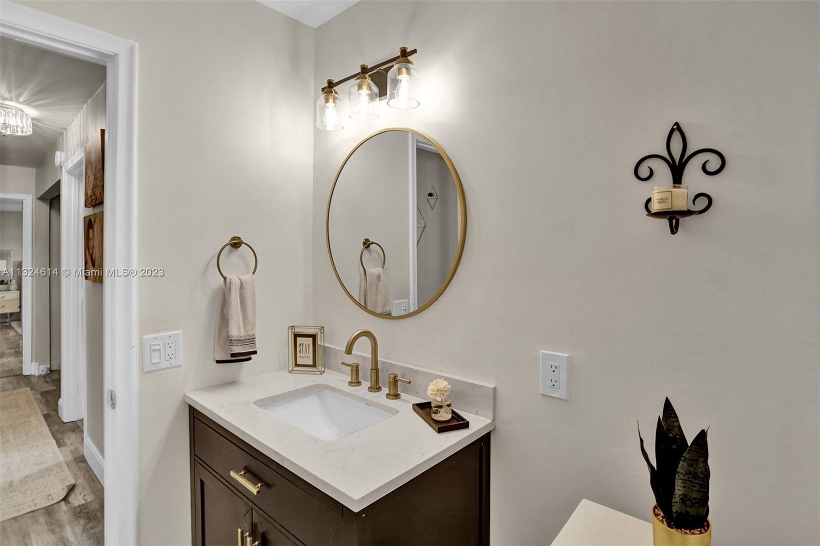 22777 Southwest 56th Avenue Boca Raton, FL 33433 - Photo 4 of 34 a bathroom with a sink and a mirror