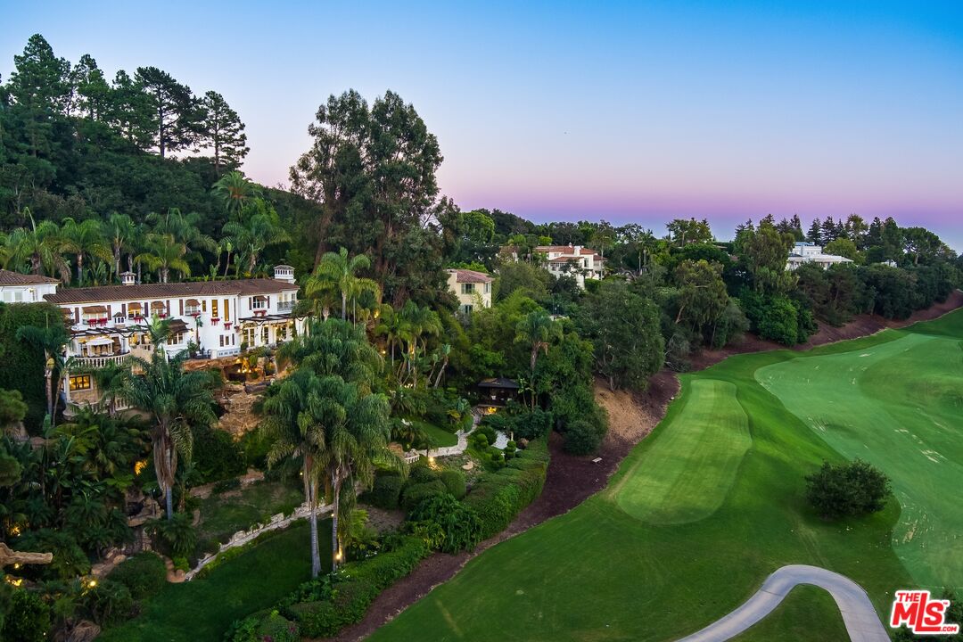 10824 Chalon Road Los Angeles, CA 90077 - Photo 2 of 40 a view of a garden with a building in background