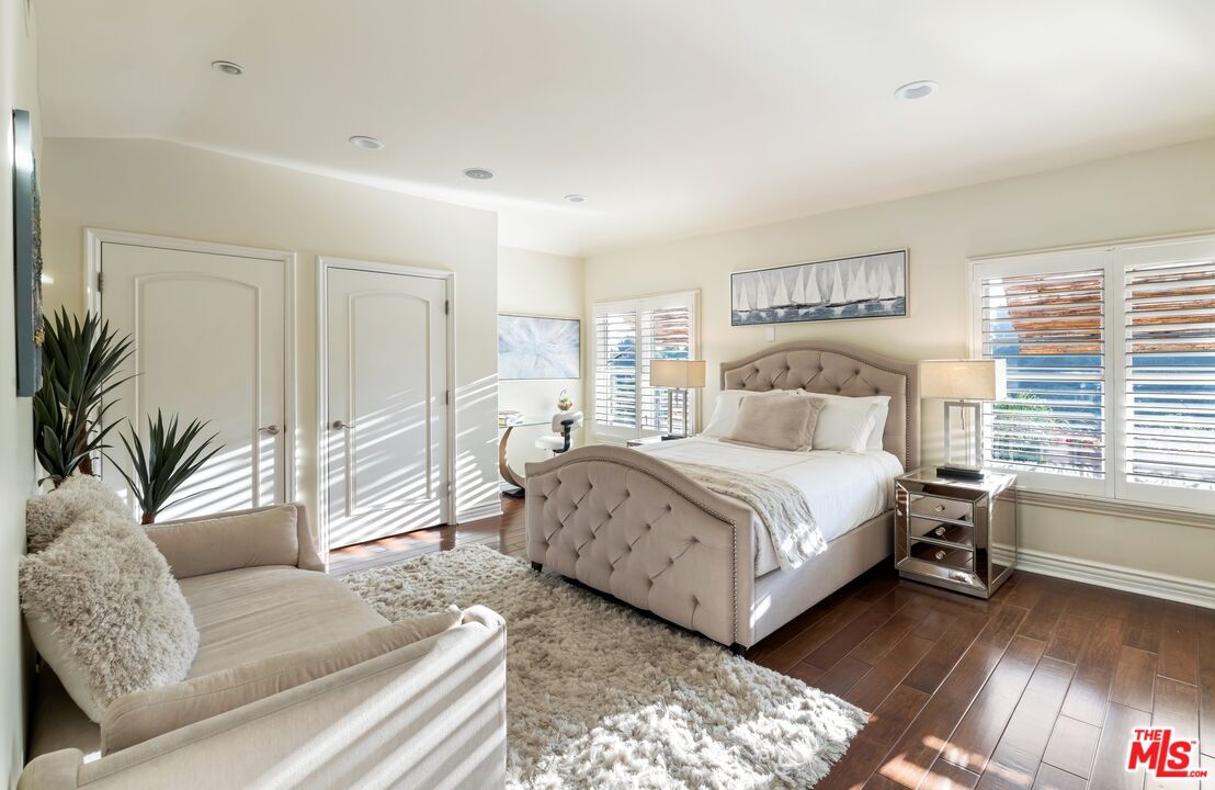 10824 Chalon Road Los Angeles, CA 90077 - Photo 23 of 40 a bedroom with a large bed and a couch