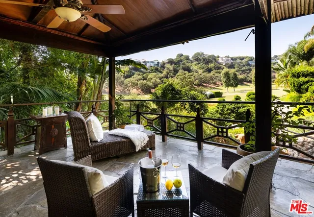 a view of living room with patio furniture and garden