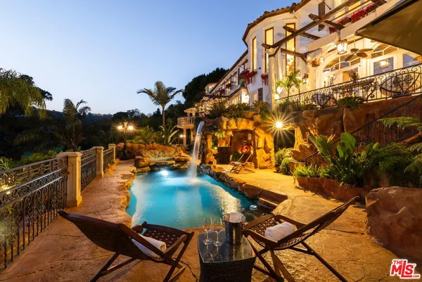 a view of a swimming pool with a patio