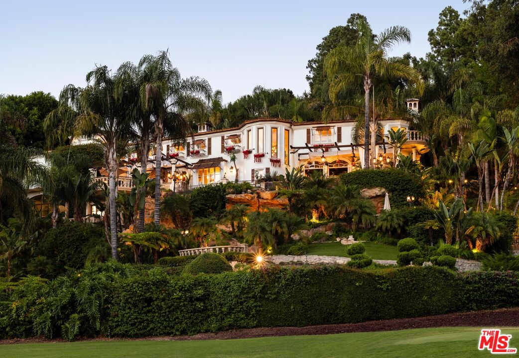 10824 Chalon Road Los Angeles, CA 90077 - Photo 36 of 40 a view of a town with large trees and cars parked
