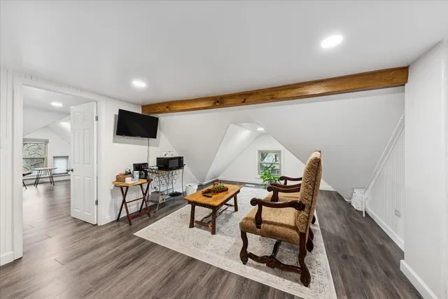 a reading room with furniture and wooden floor