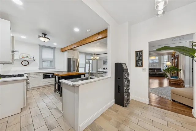 a kitchen with stainless steel appliances granite countertop a stove and cabinets