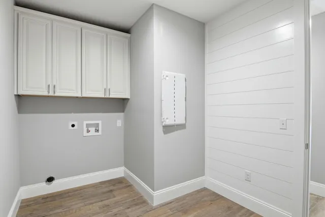 a view of storage and utility room with closet