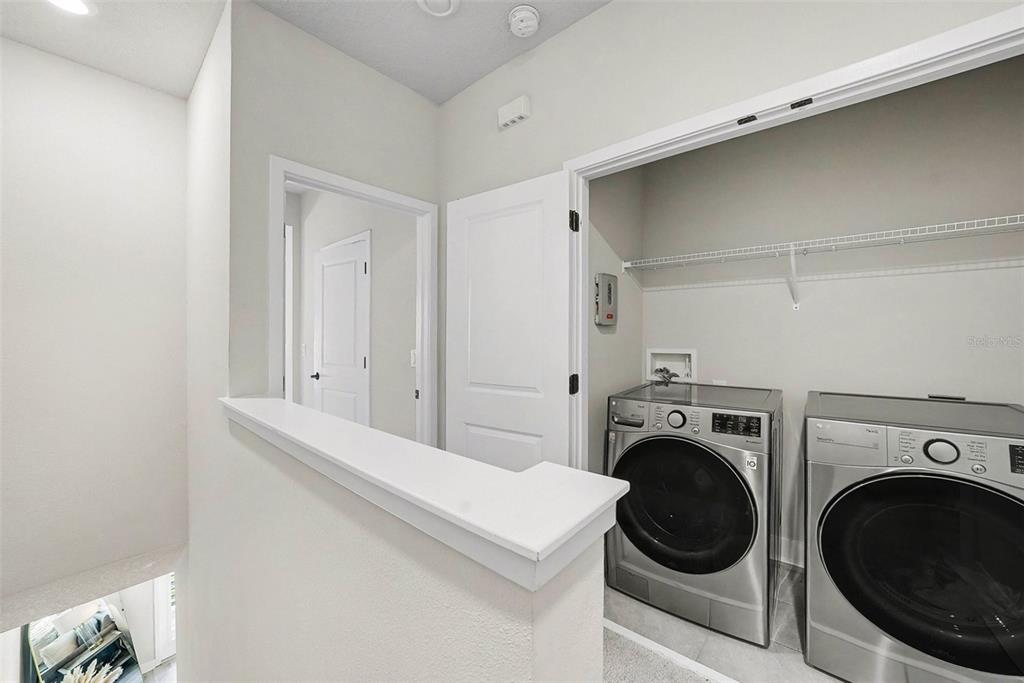 2511 North Grady Avenue, Unit 26 Tampa, FL 33607 - Photo 14 of 30 a view of a hallway with washer and dryer