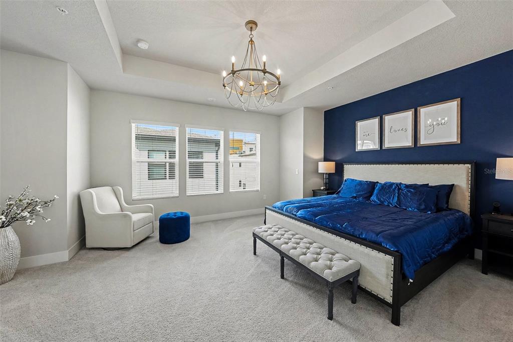 2511 North Grady Avenue, Unit 26 Tampa, FL 33607 - Photo 17 of 30 a bedroom with a bed and a couch