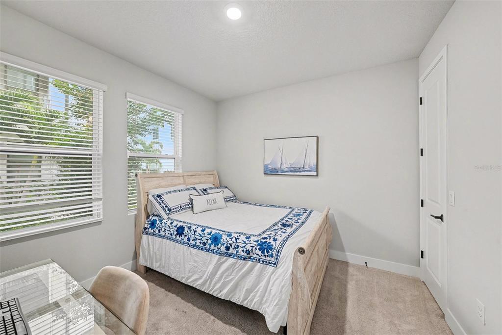 2511 North Grady Avenue, Unit 26 Tampa, FL 33607 - Photo 19 of 30 a bedroom with a bed and a window