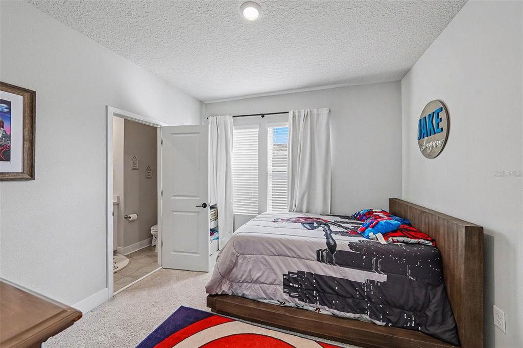 2511 North Grady Avenue, Unit 26 Tampa, FL 33607 - Photo 22 of 30 a bedroom with a bed and a window