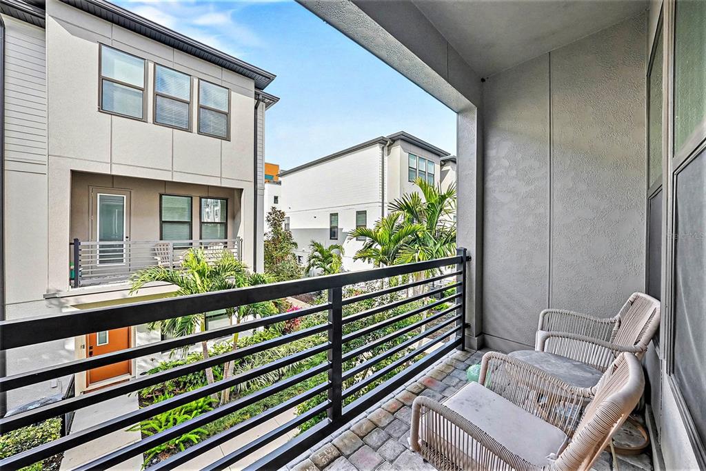 2511 North Grady Avenue, Unit 26 Tampa, FL 33607 - Photo 25 of 30 a view of two chairs in the balcony
