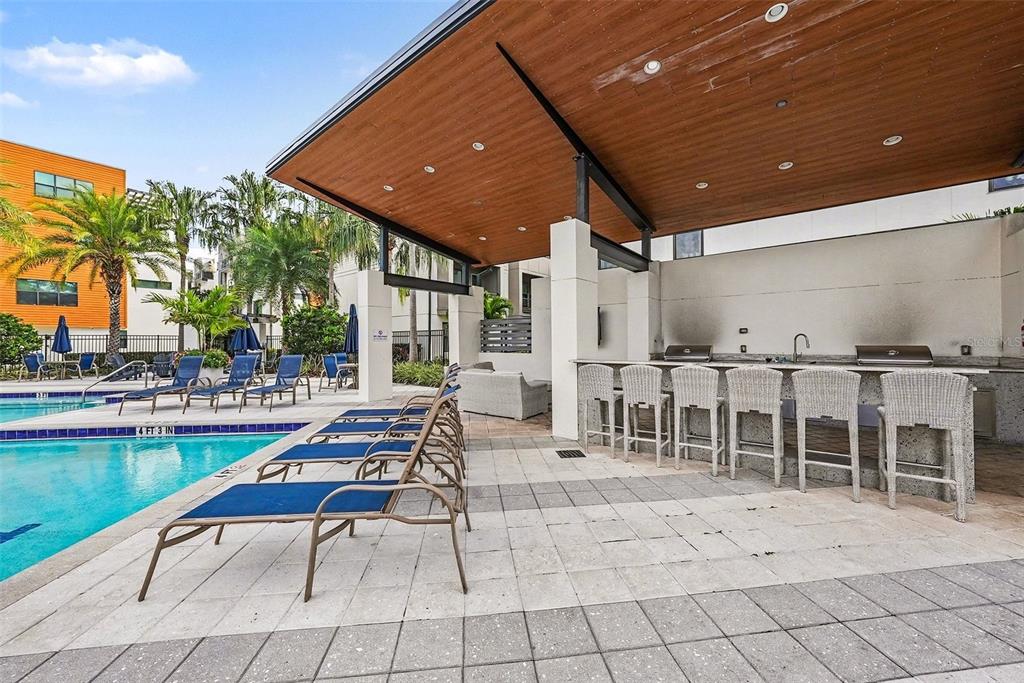 2511 North Grady Avenue, Unit 26 Tampa, FL 33607 - Photo 27 of 30 a outdoor space with lots of white furniture and garden