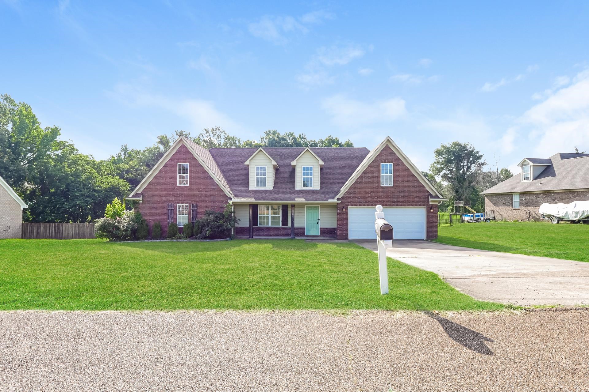 188 David Reed Drive Munford, TN 38058 - Photo 1 of 20 Brick exterior with light-colored gables and dormer windows