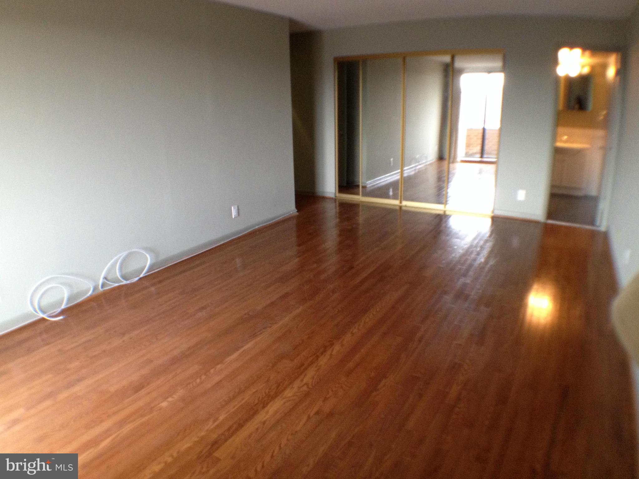 111 Hamlet Hill Road, Unit 902 Baltimore, MD 21210 - Photo 13 of 30 a view of a livingroom with wooden floor