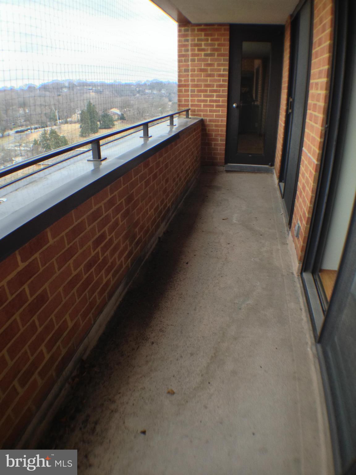 111 Hamlet Hill Road, Unit 902 Baltimore, MD 21210 - Photo 27 of 30 a view of a floor to ceiling window and an outdoor view