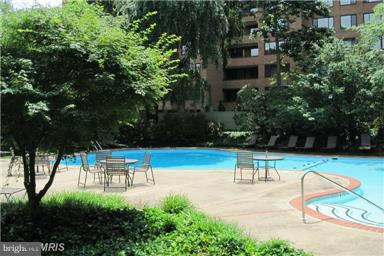 111 Hamlet Hill Road, Unit 902 Baltimore, MD 21210 - Photo 29 of 30 a view of a swimming pool with a patio