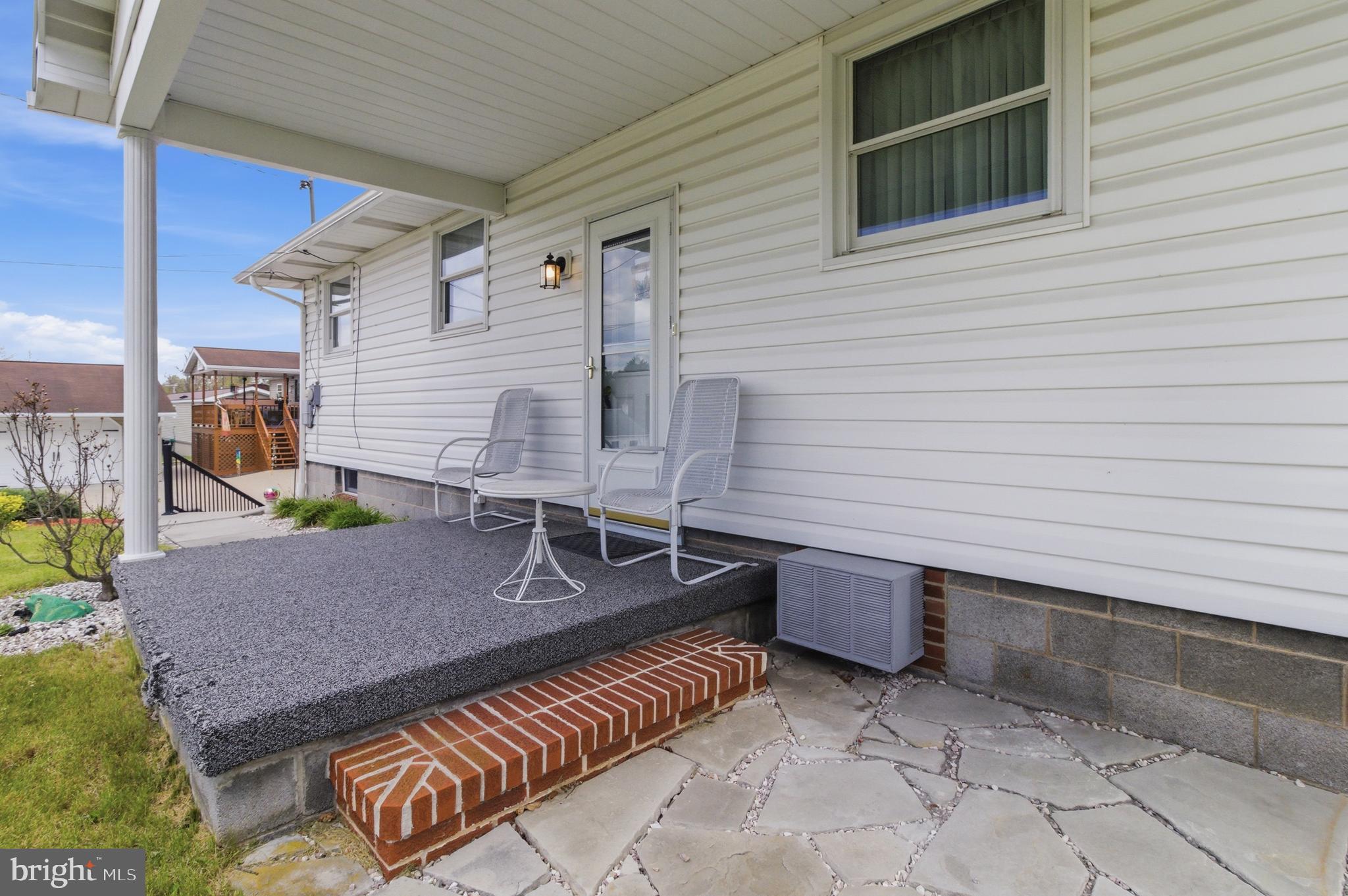684 Powell Street Hawk Run, PA 16840 - Photo 12 of 35 Close up of back porch, additional A/C unit shown.