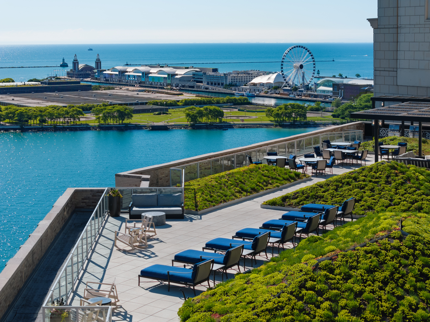 850 North Lake Shore Drive, Unit 1410 Chicago, IL 60611 - Photo 13 of 21 a view of a city from a balcony with chairs