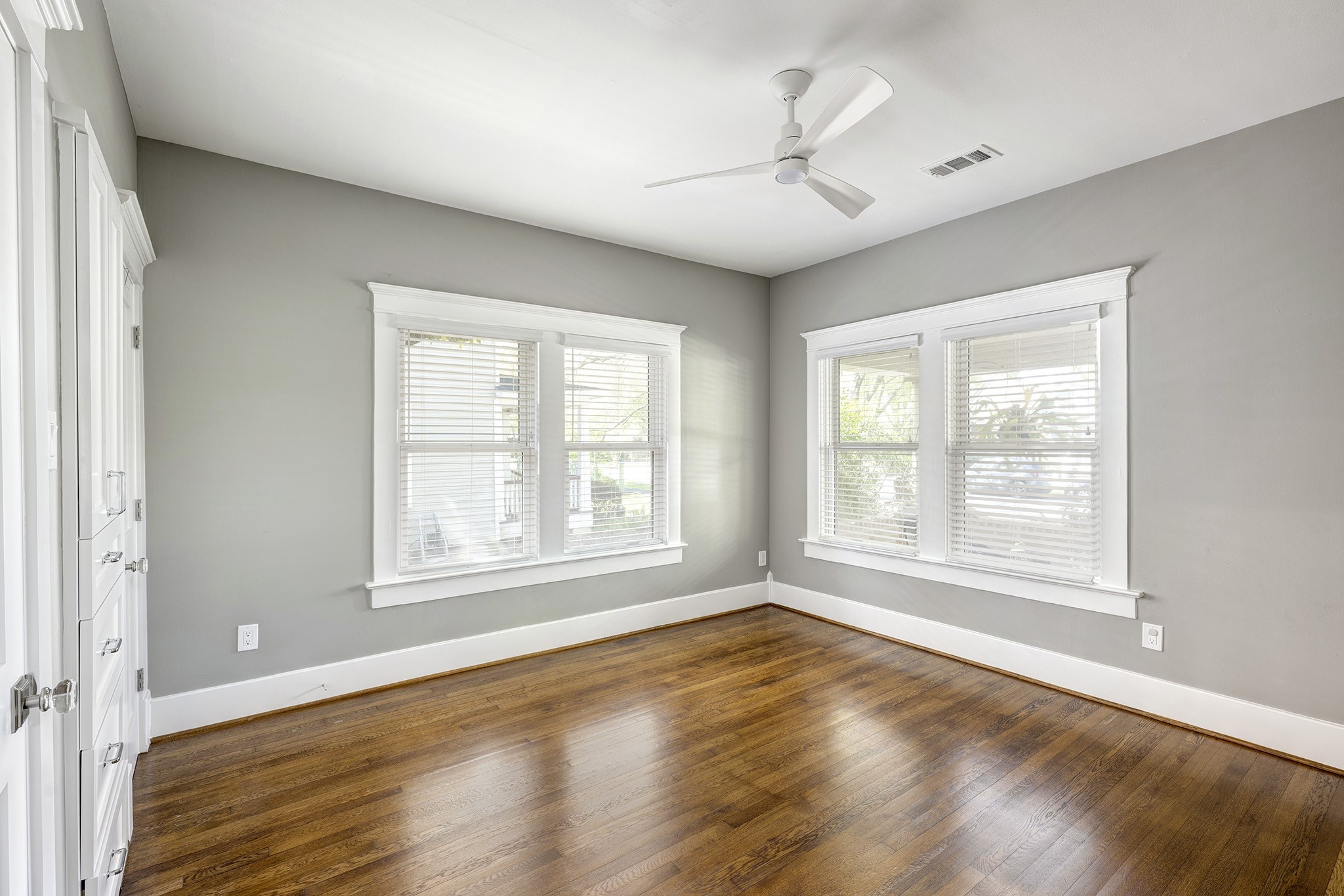 1314 Harvard Street Houston, TX 77008 - Photo 18 of 36 a view of an empty room with a window and wooden floor
