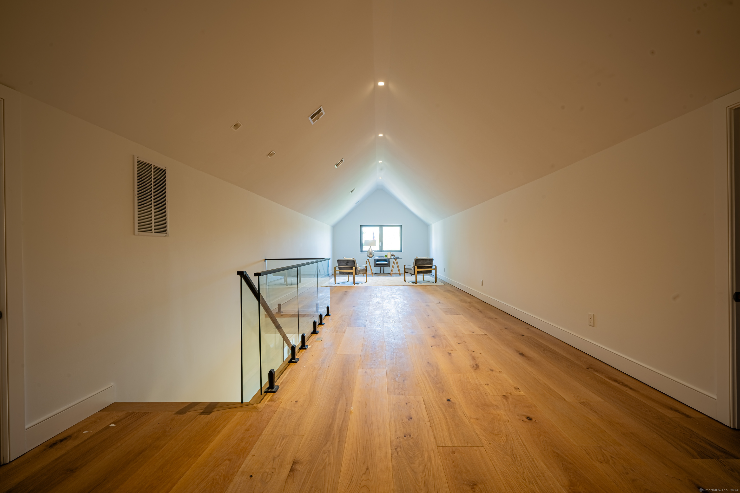 14 5 Mile River Road Darien, CT 06820 - Photo 19 of 21 a view of empty room with wooden floor