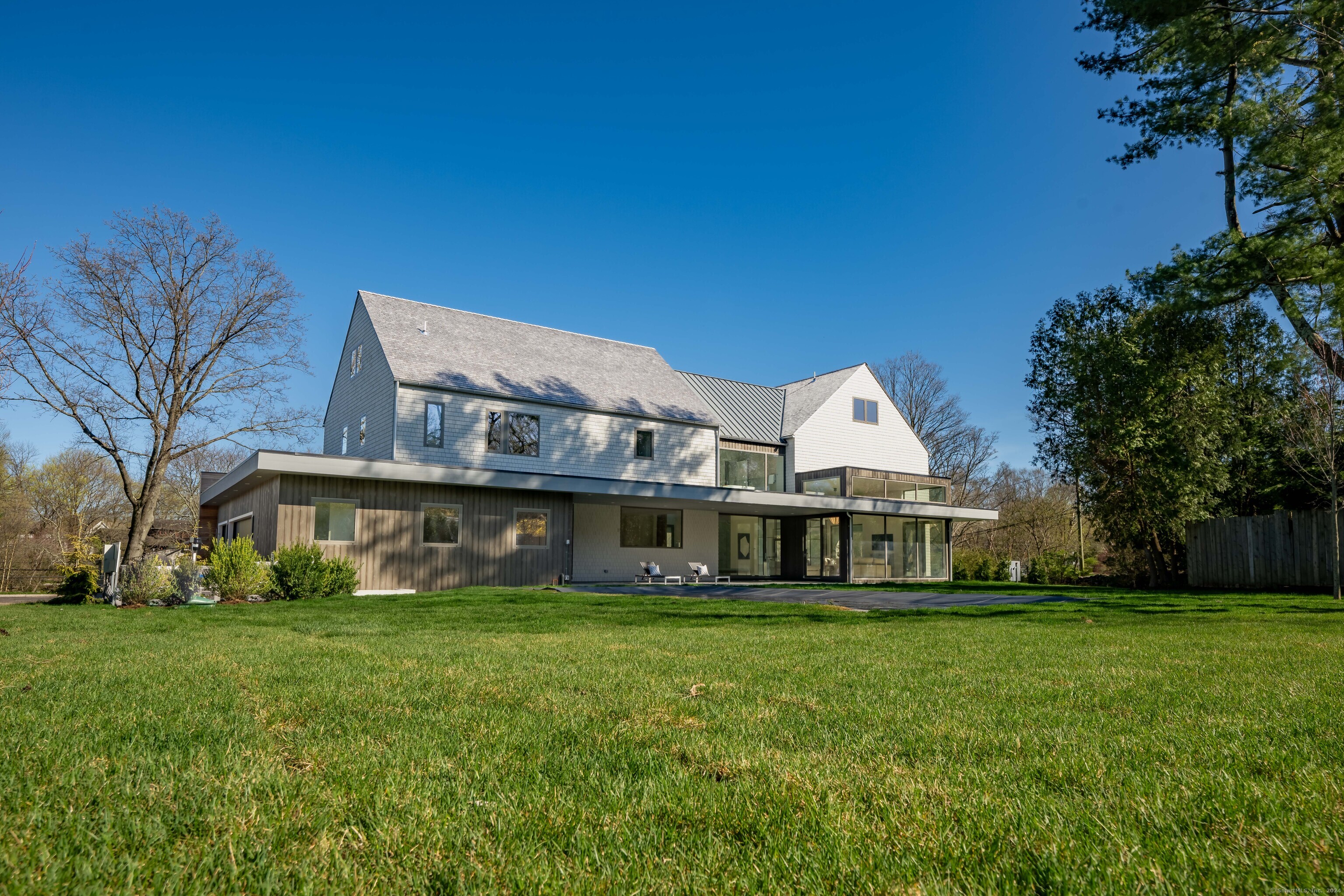 14 5 Mile River Road Darien, CT 06820 - Photo 21 of 21 a front view of house with yard and green space