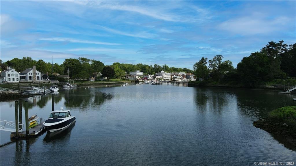 14 5 Mile River Road Darien, CT 06820 - Photo 3 of 21 a view of a lake with boats and trees in the background