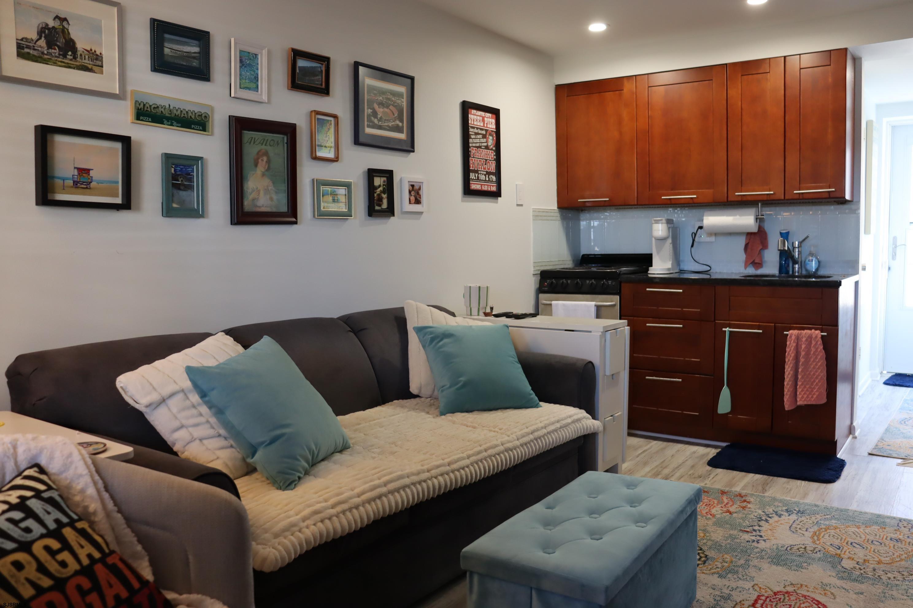 9201 Atlantic Avenue, Unit 18 Margate City, NJ 08402 - Photo 6 of 12 a living room with furniture and a window