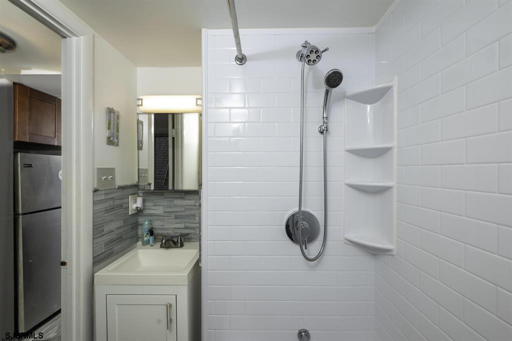 9201 Atlantic Avenue, Unit 18 Margate City, NJ 08402 - Photo 9 of 12 a bathroom with a shower