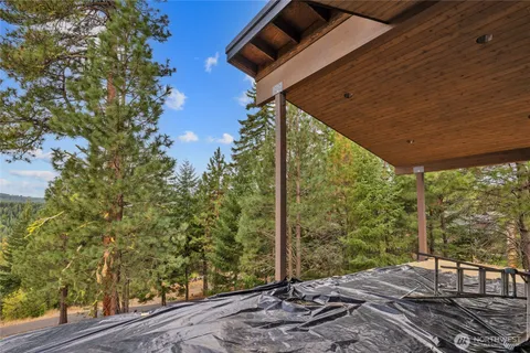 a view of an empty room with painting on the wall