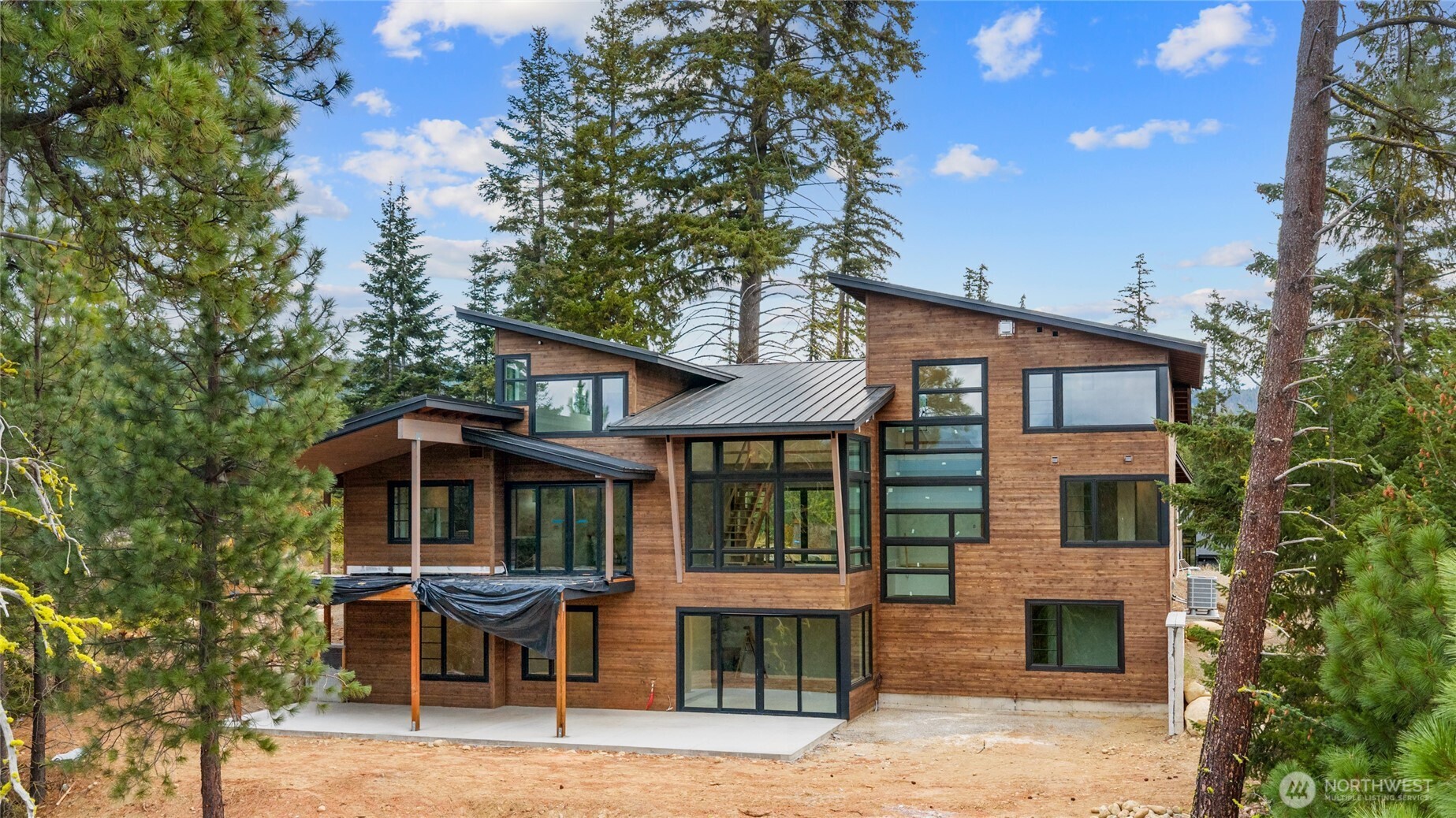 331 Kokanee Loop Cle Elum, WA 98922 - Photo 2 of 40 a front view of a house with garden