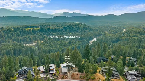 a view of a lush green outdoor space with a lake view