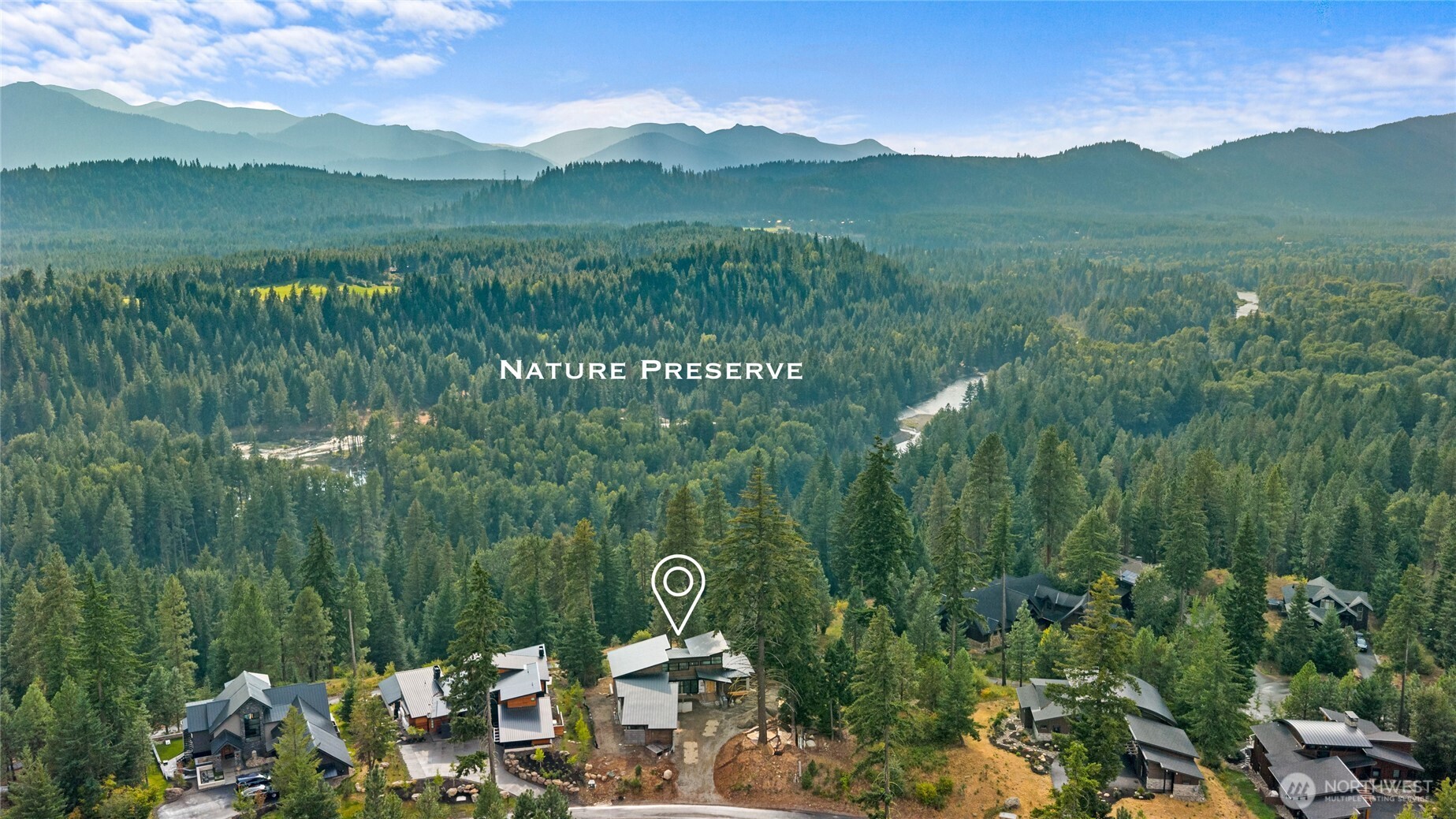 331 Kokanee Loop Cle Elum, WA 98922 - Photo 32 of 40 a view of a lush green hillside and houses