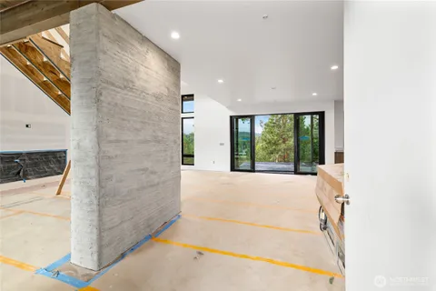 a room with a sink and large window