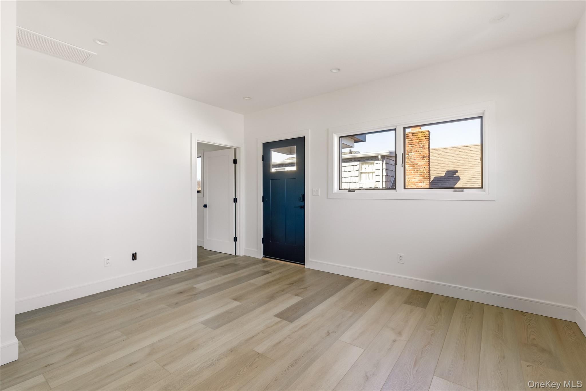 56 Suffolk Road Island Park, NY 11558 - Photo 11 of 14 an empty room with a window