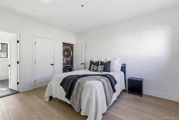 a bed room with a bed and a night stand